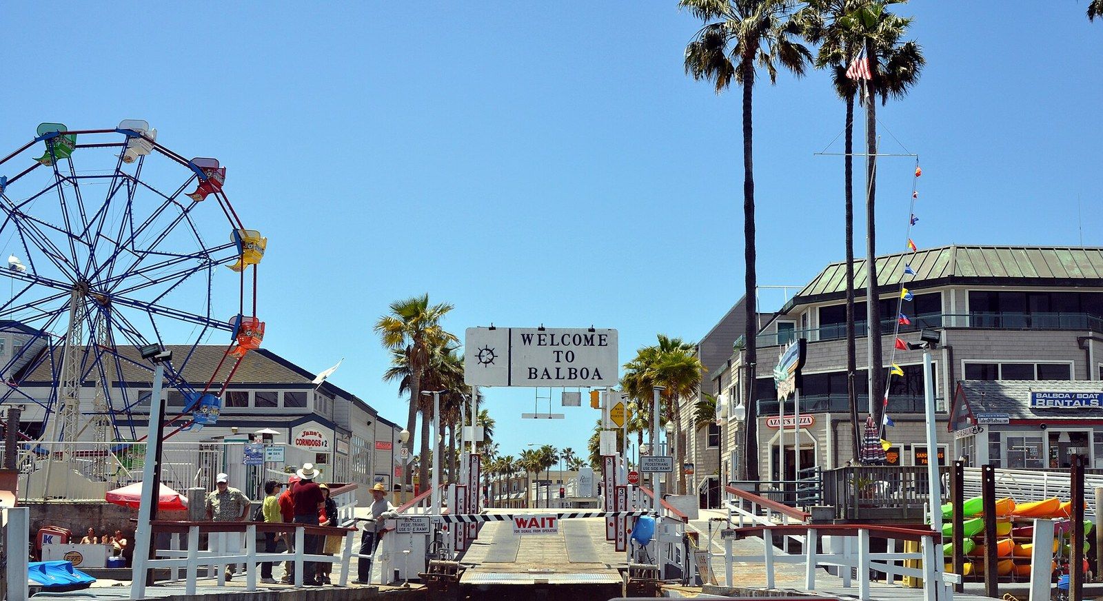 The Balboa Fun Zone Ferris wheel beside the Welcome to Balboa ferry landing