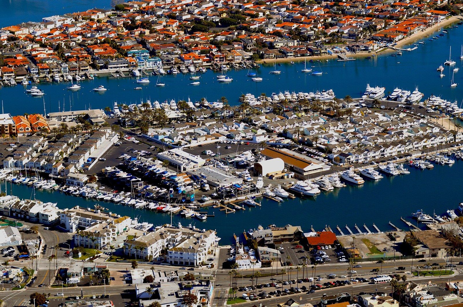 Aerial view of the Lido Peninsula and the Rhine Channel lined with moored boats