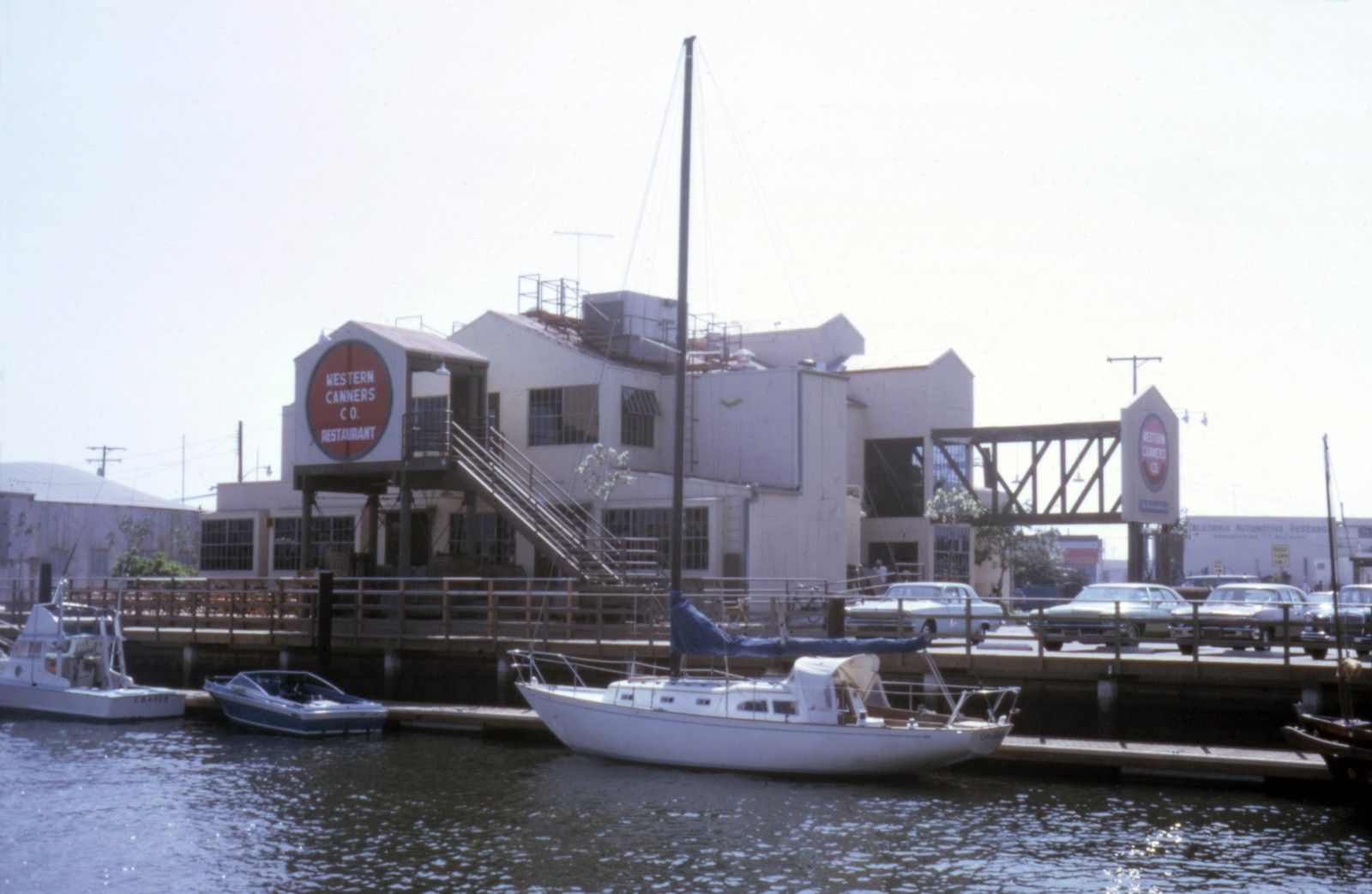 The Cannery building on the Rhine Channel in 1974, with sailboats tied up at its dock